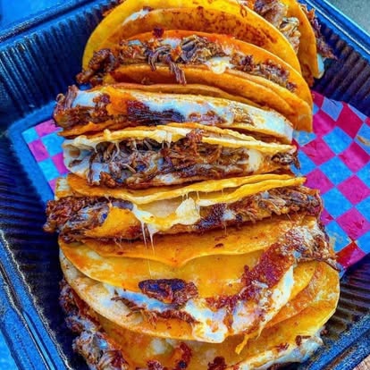 Tacos with avocado and fresh garnish on a plate